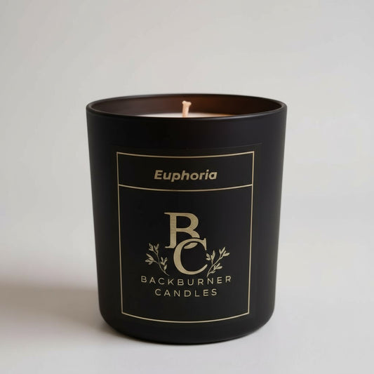 Black candle in a container with 'Euphoria' and 'Backburner Candles' branding on a light gray background.