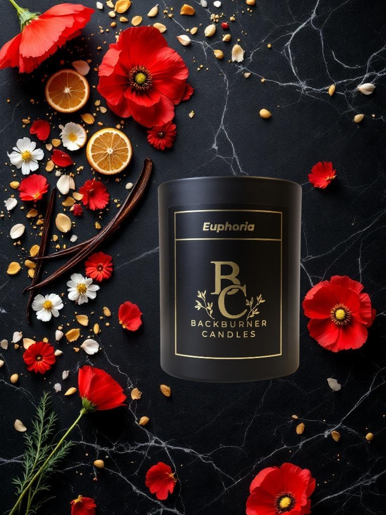 Backburner Candles Euphoria candle surrounded by red flowers and vanilla beans on a dark surface