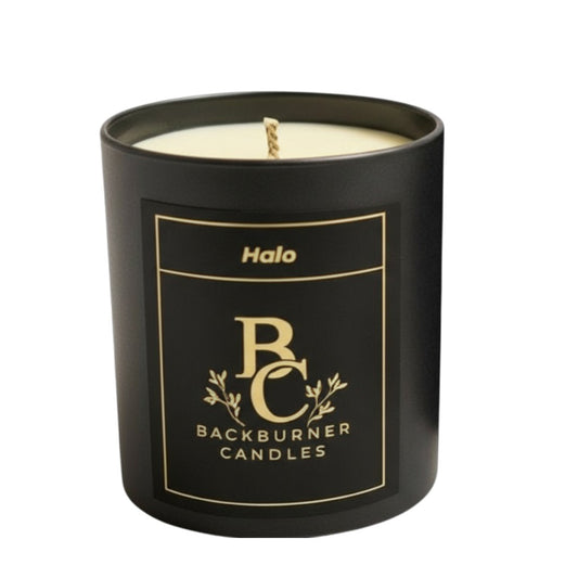 Black candle with 'Backburner Candles' branding on a white background