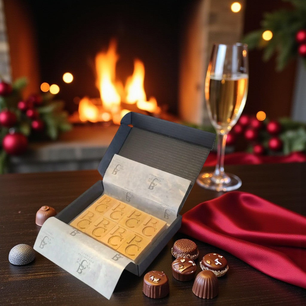 Backburner Candles wax melts styled with chocolates, champagne, and festive fireplace for holiday gifting