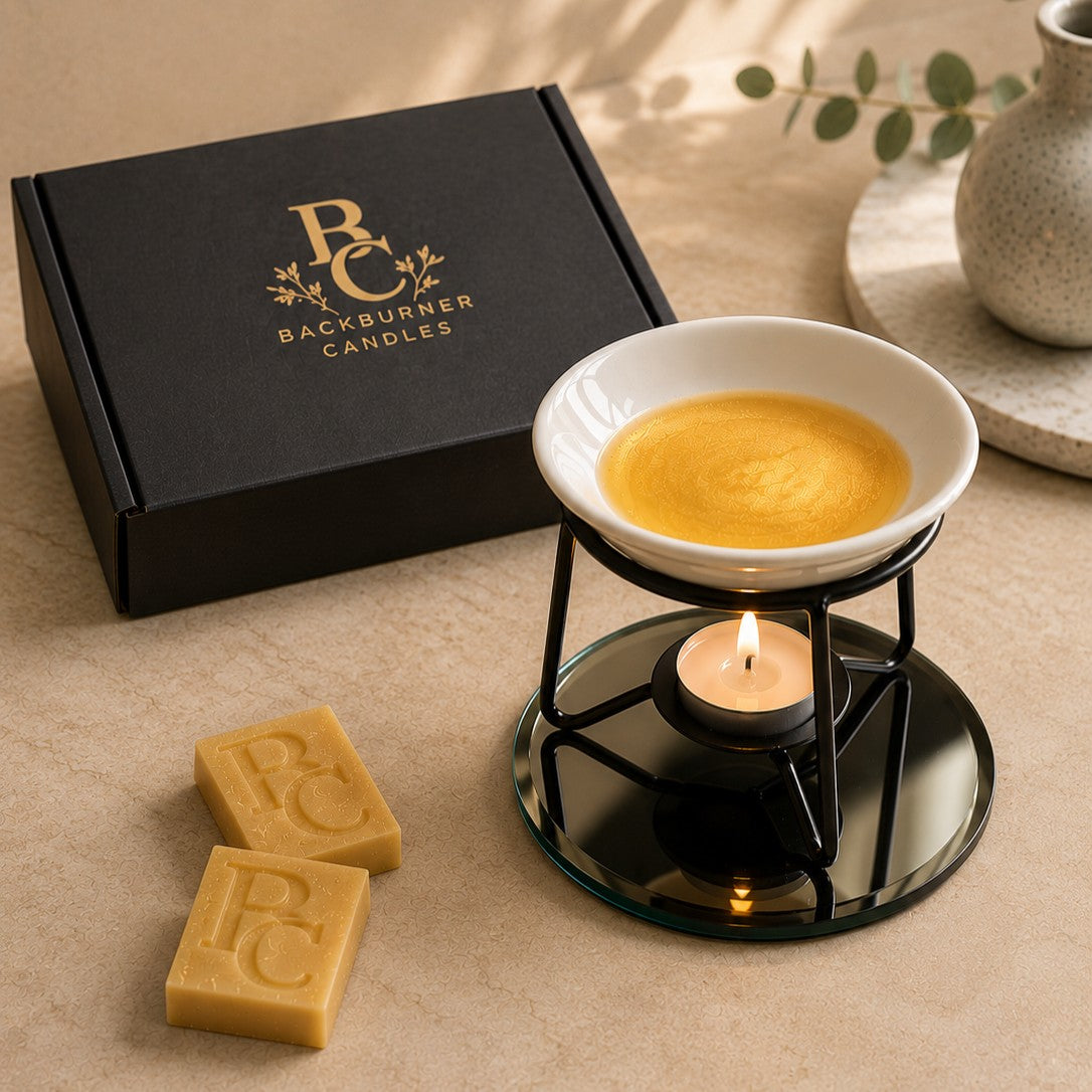 Backburner Candles product with wax tart and warmer on a neutral surface