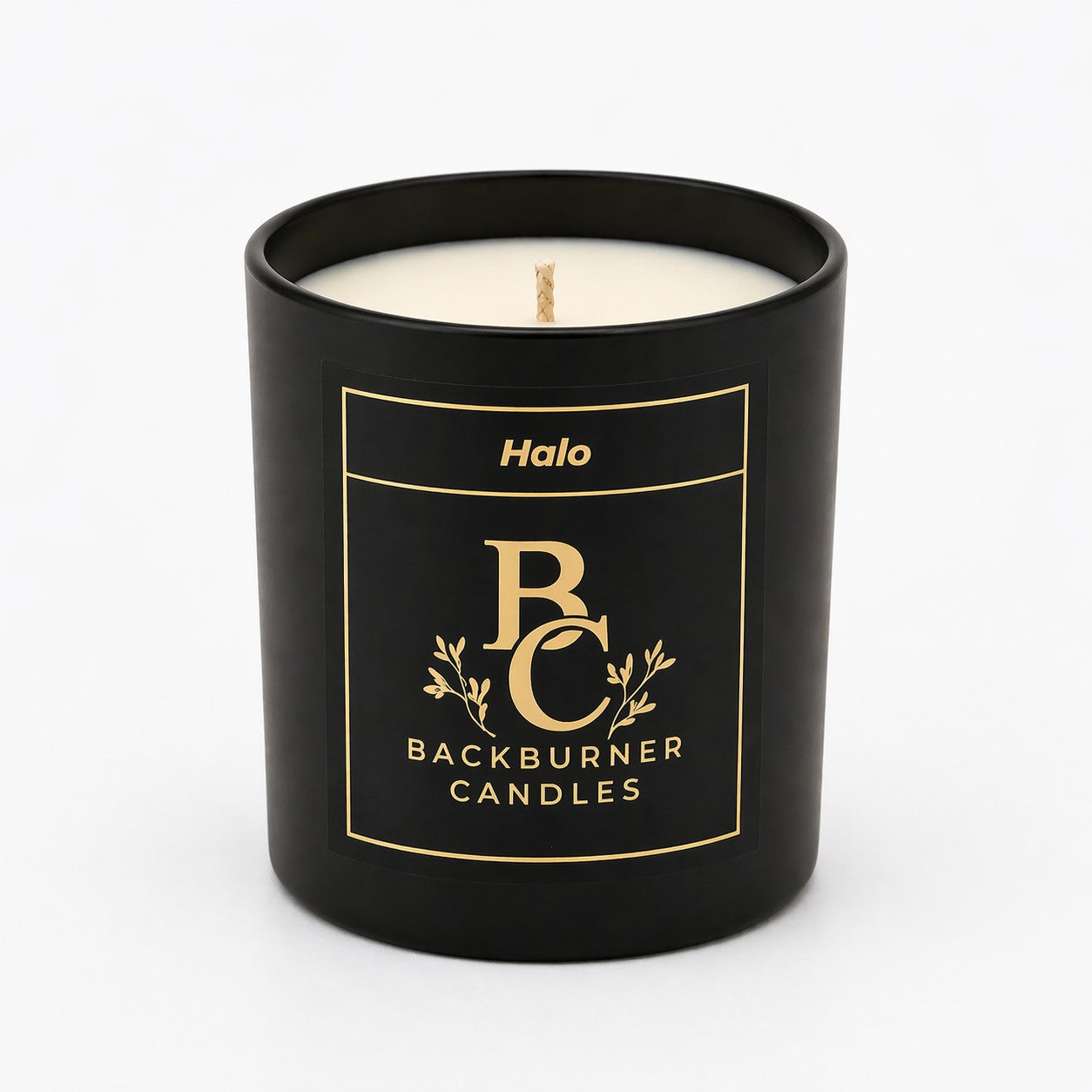 Black candle with 'Halo' branding on a white background