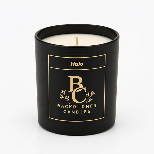 Black candle with 'Halo' branding on a white background