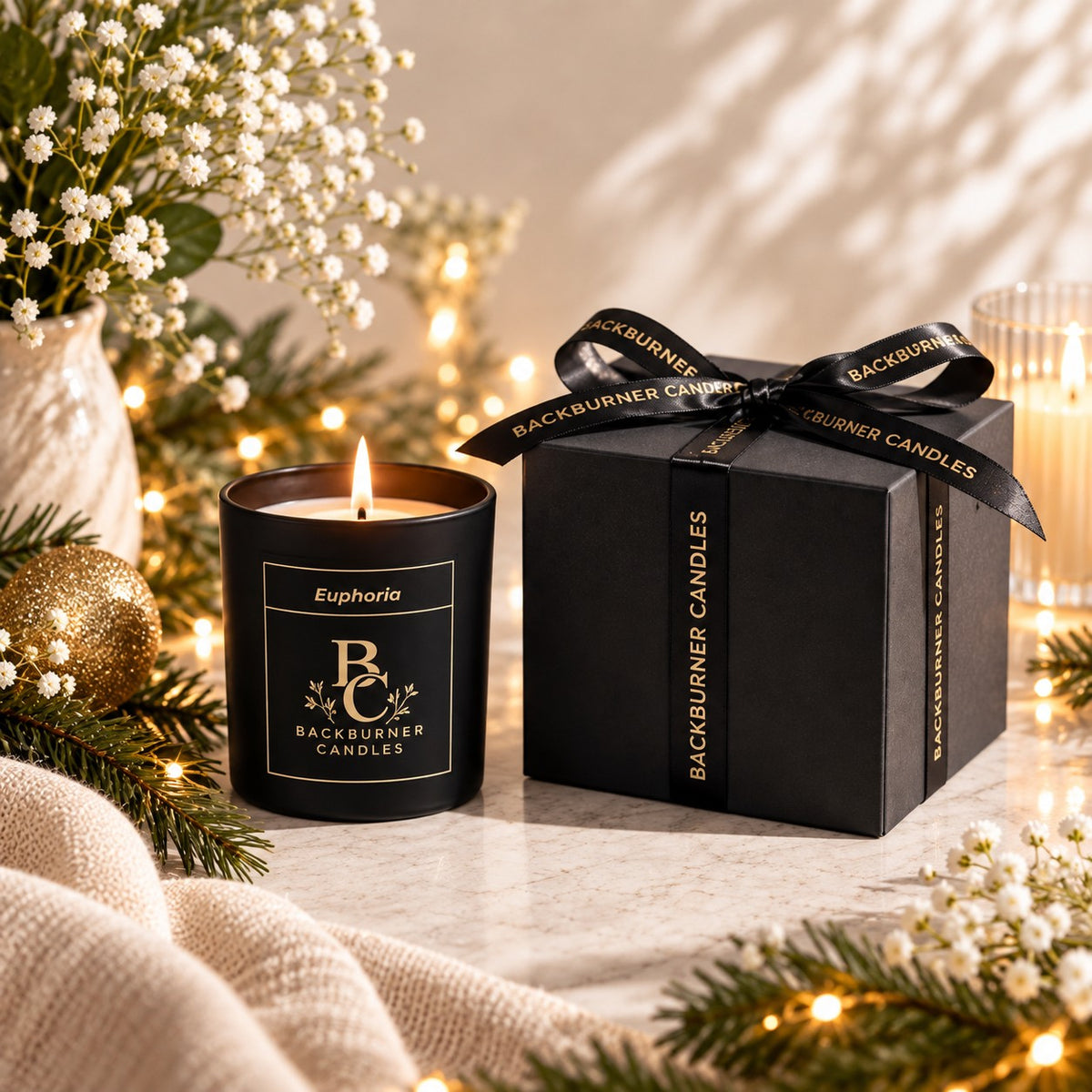 Euphoria candle with box in Christmas setting