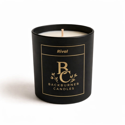 Black candle with 'Rival Backburner Candles' branding on a white background